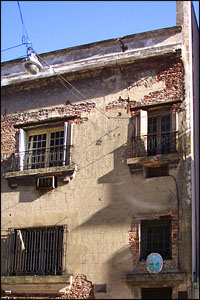 Paula liked the weathered look of this brick building  in Buenos Aires with its decaying faux-stone plaster work.