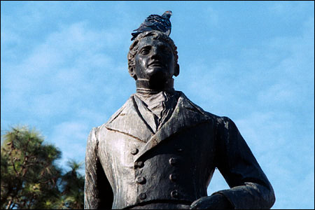 General Belgrano's statue appears to maintain its dignity, despite the pigeon's roosting atop it. General Belgrano designed the Argentine Flag.