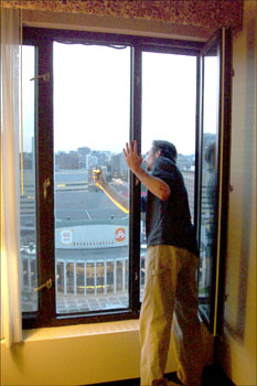  Here Willie risks all to get a shot of the view from our suite at the Wyndham Montreal.