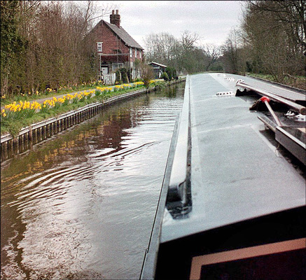 Narrowboat. April flowers were blossoming along many sections of the canal.