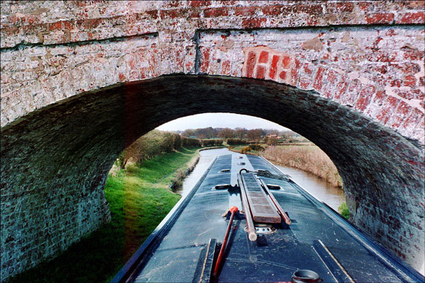 Narrowboat. Line a 54 foot boat up to glide smoothly through a narrow opening without bumping or scraping the sides of the boat.