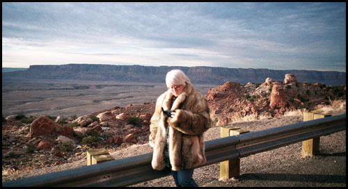 Marble Canyon, AZ.  Paula, looking gorgeous in John's coyote fur coat, checks our location on the GPS