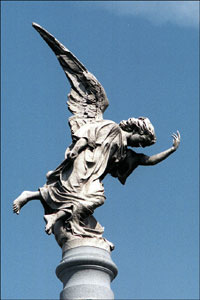 One of the many funerary statues-many of angels--that adorn the crypts and tombs of the rich and famous in Recoleta Cemetary in Buenos Aires