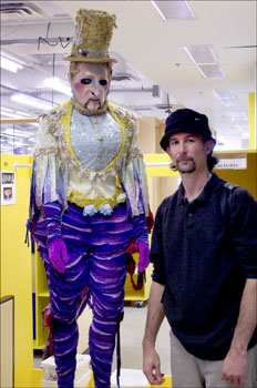 Willie with a mannequin in the Cirque du Soleil costume shop.